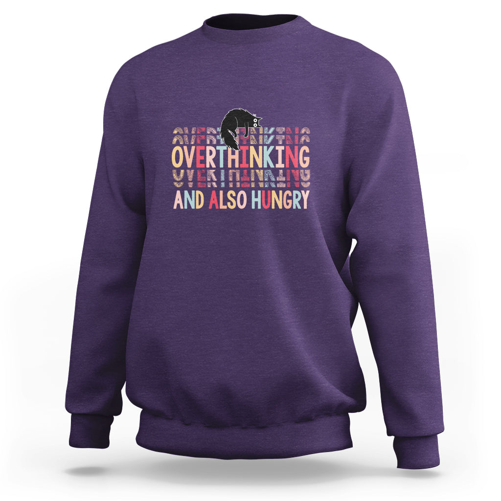 Purple crewneck sweatshirt with cute cat and “Overthinking And Also Hungry” graphic