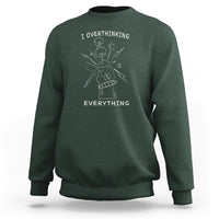 Dark green crewneck sweatshirt with front graphic text: I overthinking EVERYTHING