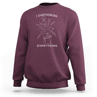 Maroon crewneck sweatshirt with front graphic text: I overthinking EVERYTHING