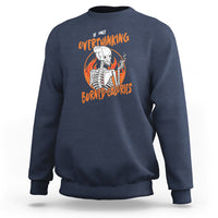 Navy sweatshirt with overthinking skeleton graphic and orange text print
