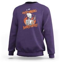 Purple sweatshirt with overthinking skeleton graphic and orange text print