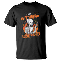Black T-shirt with orange “Overthinking Burned Calories” skeleton graphic on front.