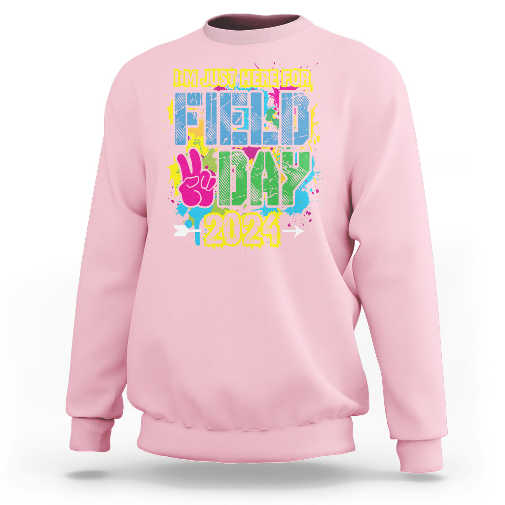 Light pink crewneck sweatshirt with colorful Field Day 2024 graphic on front