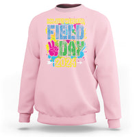 Light pink crewneck sweatshirt with colorful Field Day 2024 graphic on front