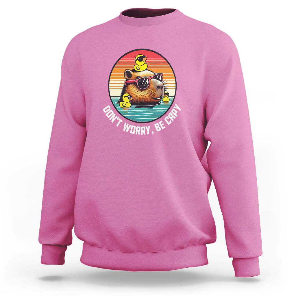 Azalea pink capybara lover sweatshirt, capybara graphic with “Don’t Worry, Be Capy”