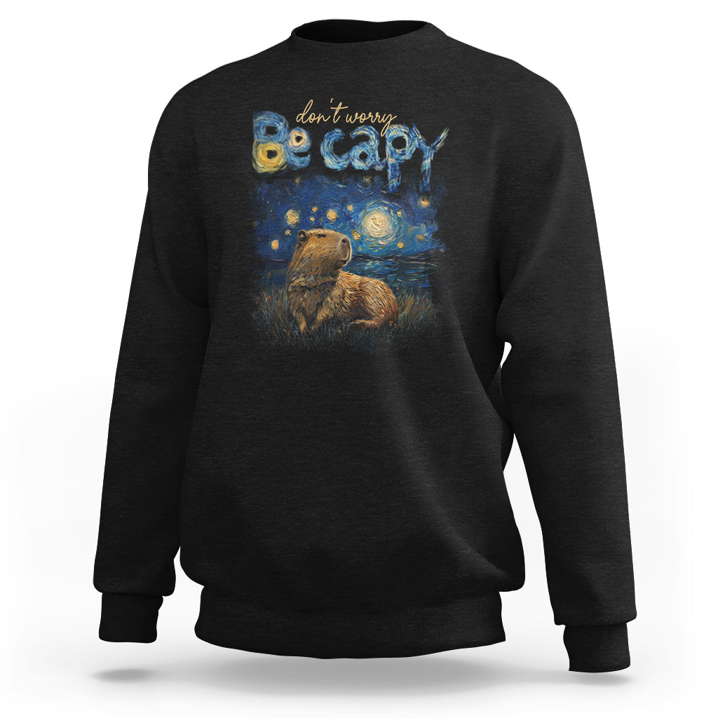 Black crewneck sweatshirt with colorful capybara night graphic on the front