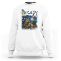 White crewneck sweatshirt with colorful capybara night graphic on the front