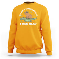 Gold crewneck sweatshirt with capybara and crocodile graphic, “I CAN SLAY” text