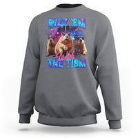 Charcoal gray sweatshirt with capybara graphic: "RIZZ 'EM" "With THE TISM"