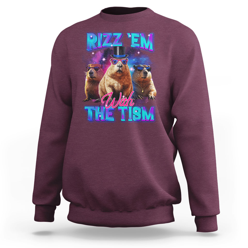 Maroon sweatshirt with capybara graphic: "RIZZ 'EM" "With THE TISM"