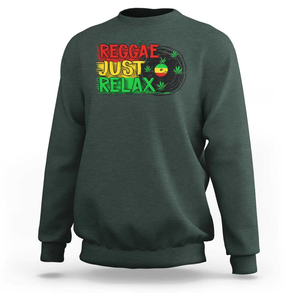 Dark forest green crewneck sweatshirt with colorful 'Reggae Just Relax' graphic and leaf print