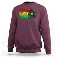 Maroon crewneck sweatshirt with colorful 'Reggae Just Relax' graphic and leaf print