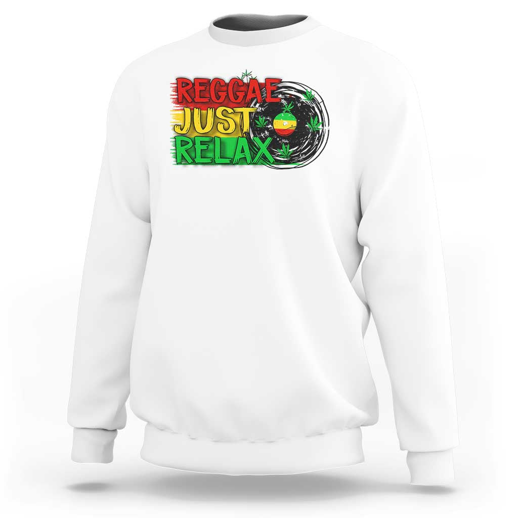 White crewneck sweatshirt with colorful 'Reggae Just Relax' graphic and leaf print