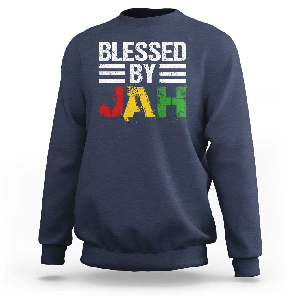 Navy crewneck sweatshirt with 'Blessed By Jah' reggae-style JAH graphic on front.