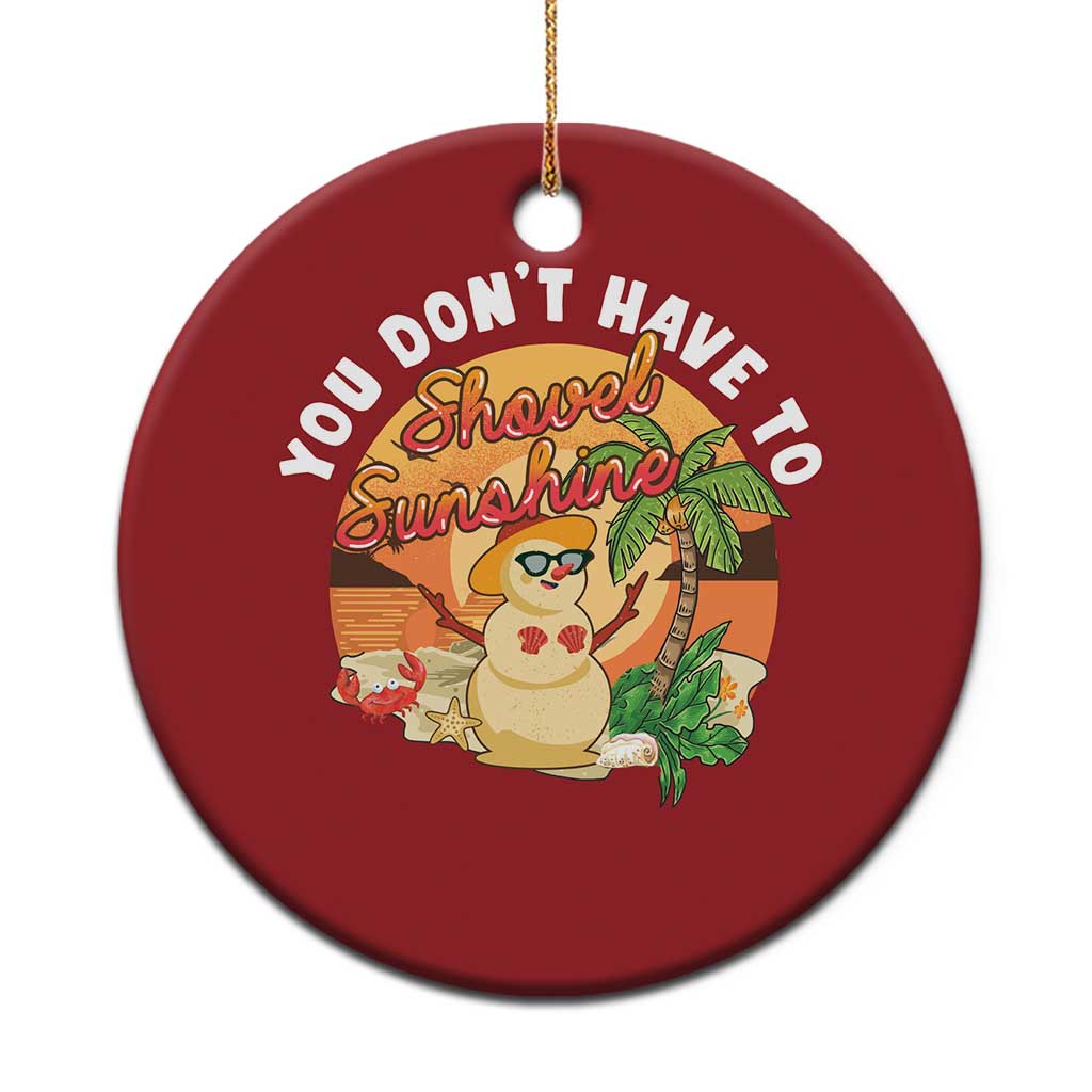Red round Christmas ornament with Hawaiian snowman graphic and 'You don't have to Shovel Sunshine'