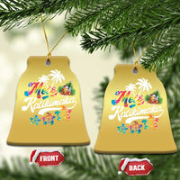 Gold bell-shaped hanging ornament with “Mele Kalikimaka” print