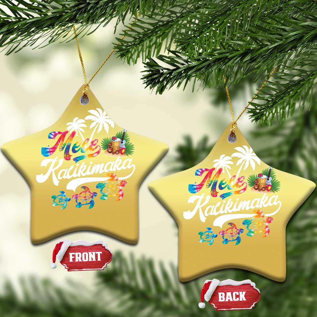 Pair of gold star-shaped hanging ornaments with “Mele Kalikimaka” print
