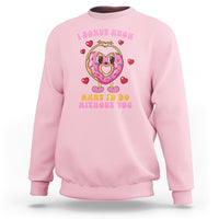 Light pink Valentine’s Day sweatshirt with donut character graphic and red heart icons