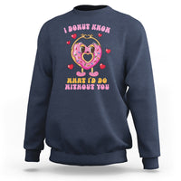 Navy Valentine’s Day sweatshirt with donut character, hearts, and colorful slogan print