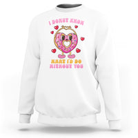White Valentine’s Day sweatshirt with pink donut character and heart-themed text