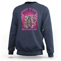 Navy sweatshirt with skeleton rocker graphic, pink wings, 'Valentine's Day' text