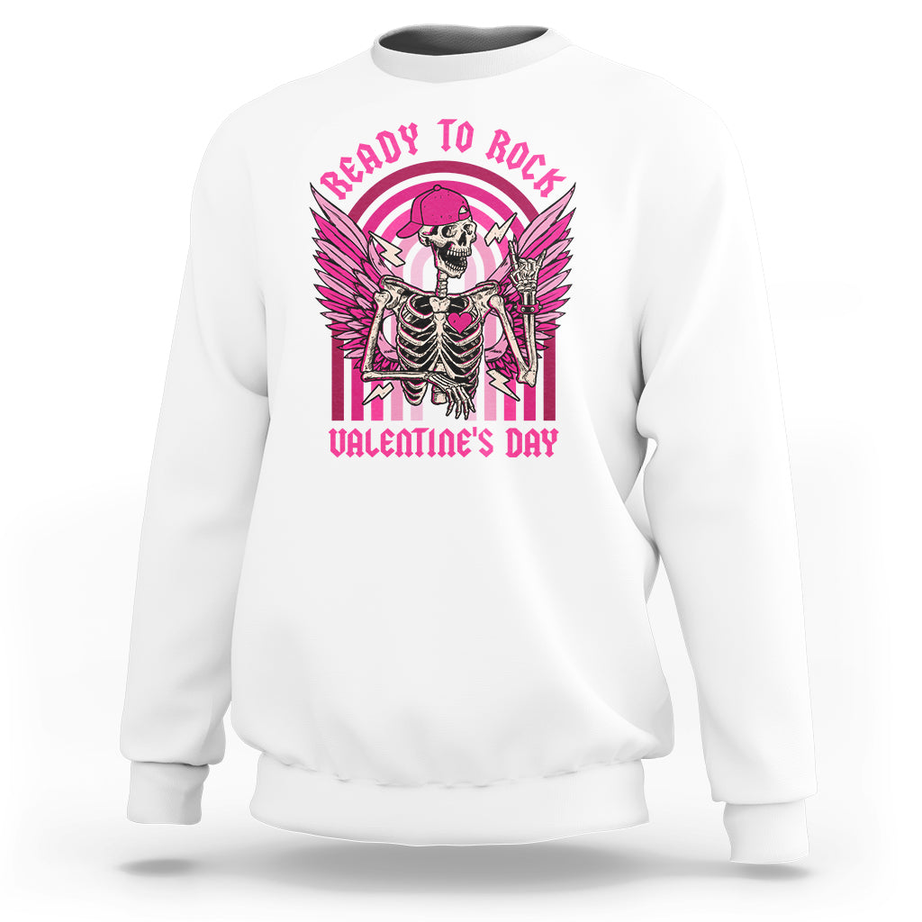 White sweatshirt with skeleton rocker graphic and wings, pink 'Valentine's Day' text