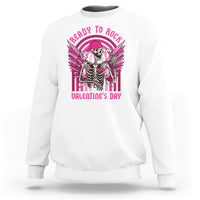 White sweatshirt with skeleton rocker graphic and wings, pink 'Valentine's Day' text