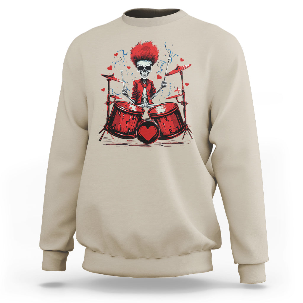 Sand beige sweatshirt with skeleton drummer graphic and red drum set artwork on front