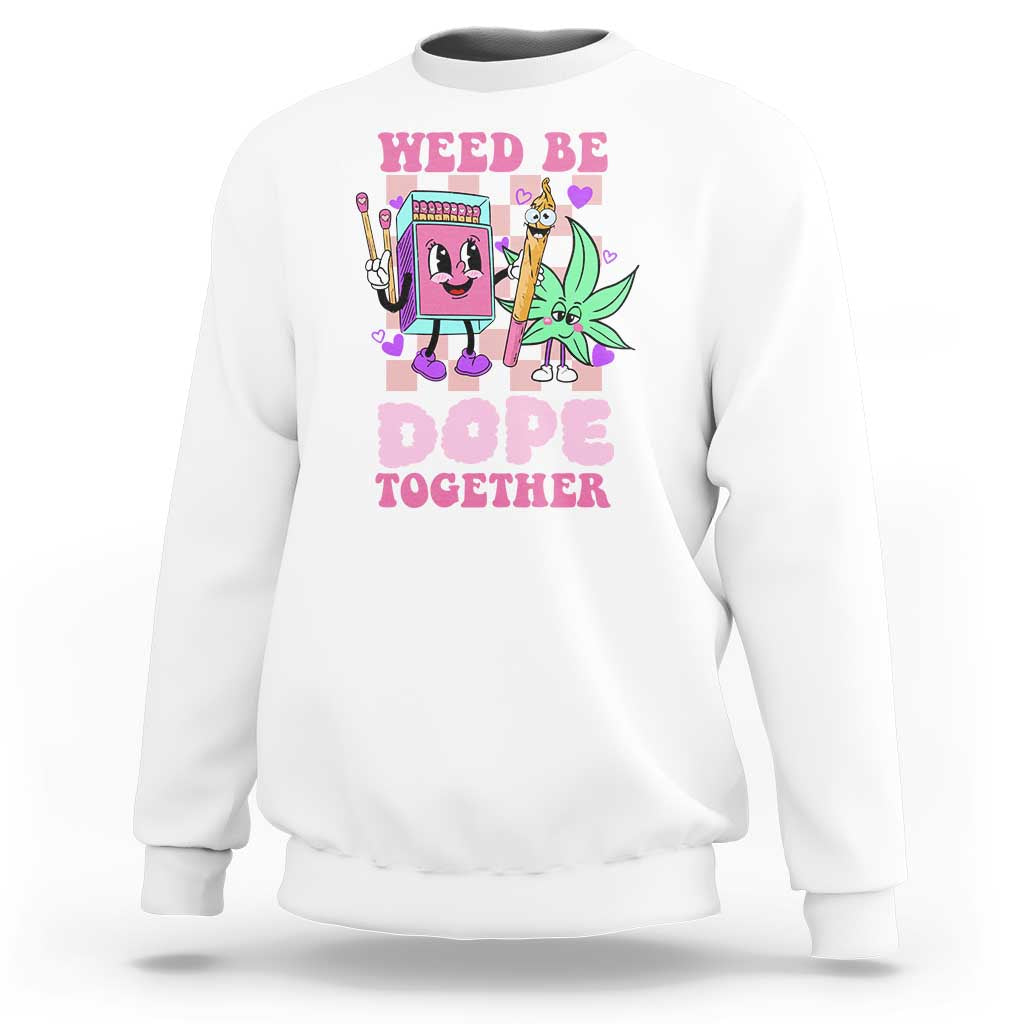 White crewneck sweatshirt with colorful front graphic reading “Weed Be Dope Together”.