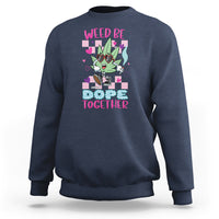 Navy crewneck sweatshirt with colorful “WEED BE DOPE TOGETHER” cannabis graphic