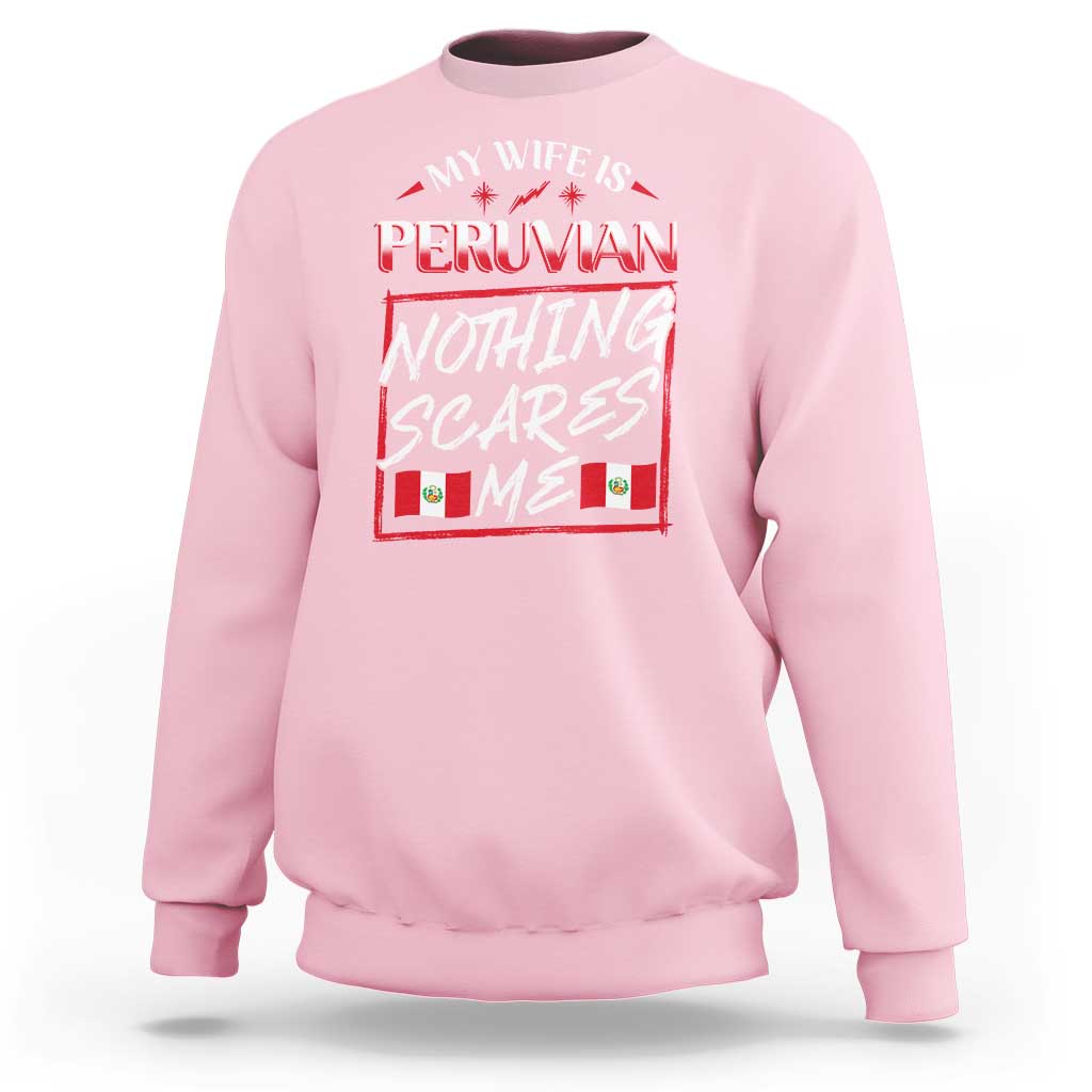 Light pink crewneck sweatshirt with Peruvian flag graphic and bold slogan on chest.
