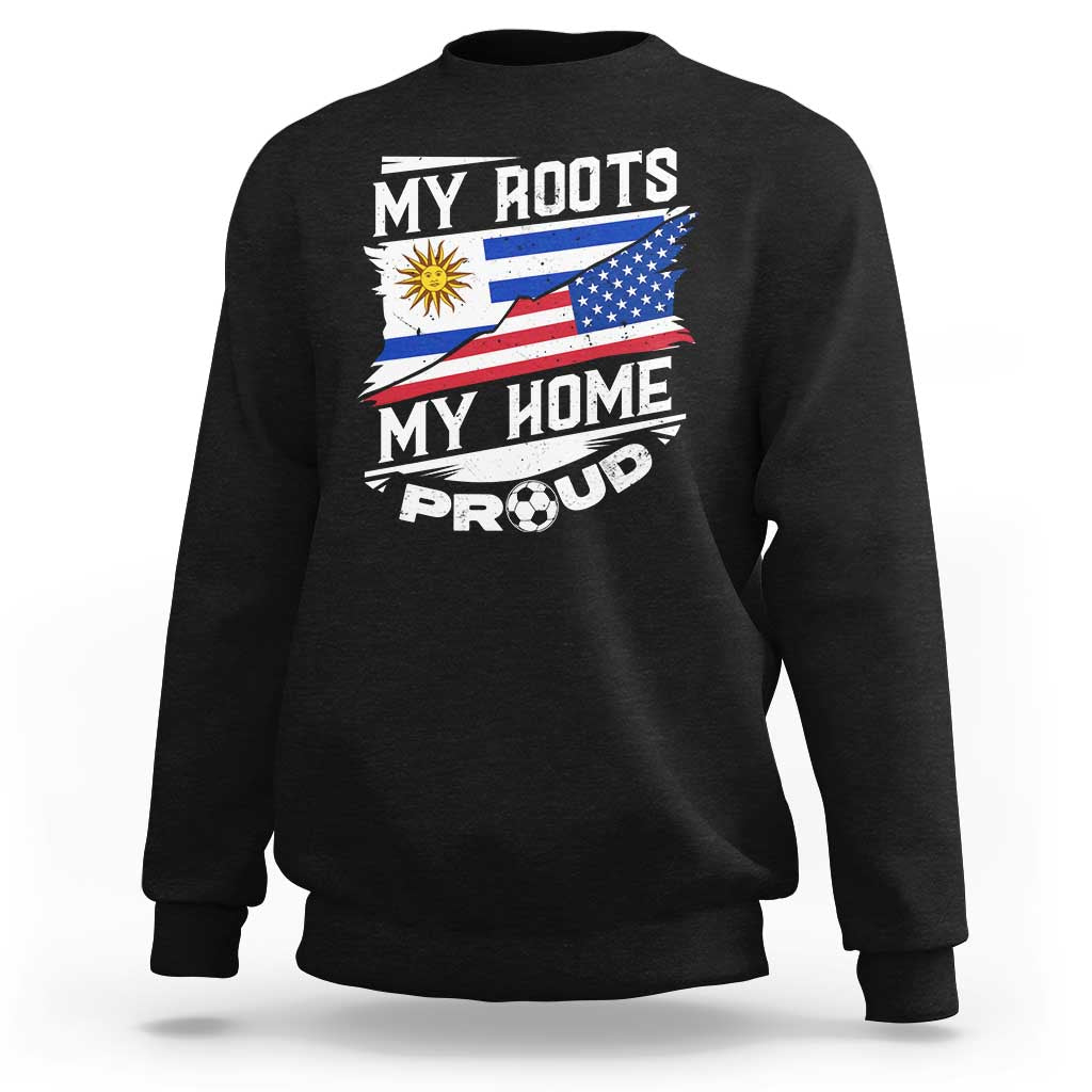 Black crewneck sweatshirt with “My Roots My Home Proud” graphic and flag design on front.