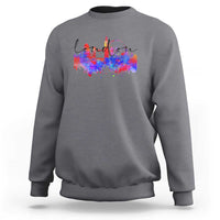Charcoal crewneck sweatshirt with multicolor city skyline graphic on front