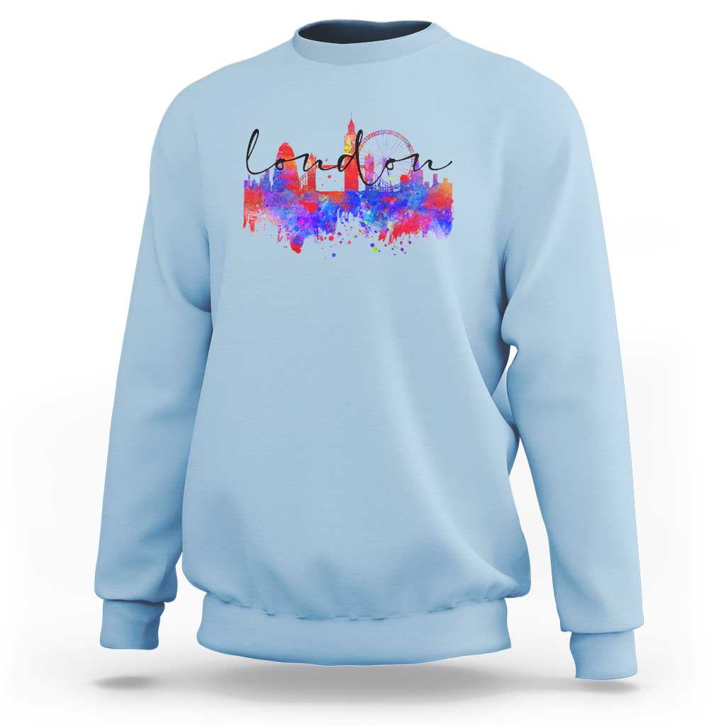 Light blue crewneck sweatshirt with multicolor city skyline graphic on front