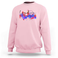 Light pink crewneck sweatshirt with multicolor city skyline graphic on front