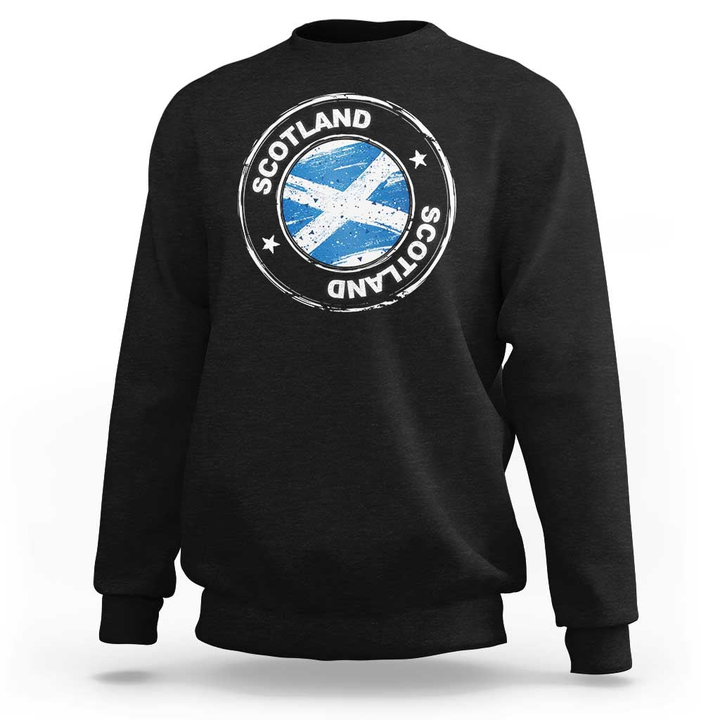 Black crewneck sweatshirt with circular Scotland logo graphic on the chest