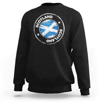 Black crewneck sweatshirt with circular Scotland logo graphic on the chest