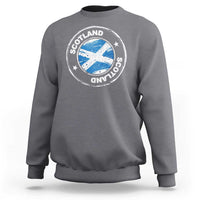 Charcoal gray crewneck sweatshirt with circular Scotland logo graphic on the chest