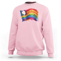 Pink crewneck sweatshirt with rainbow flag graphic and small 'la' print at chest