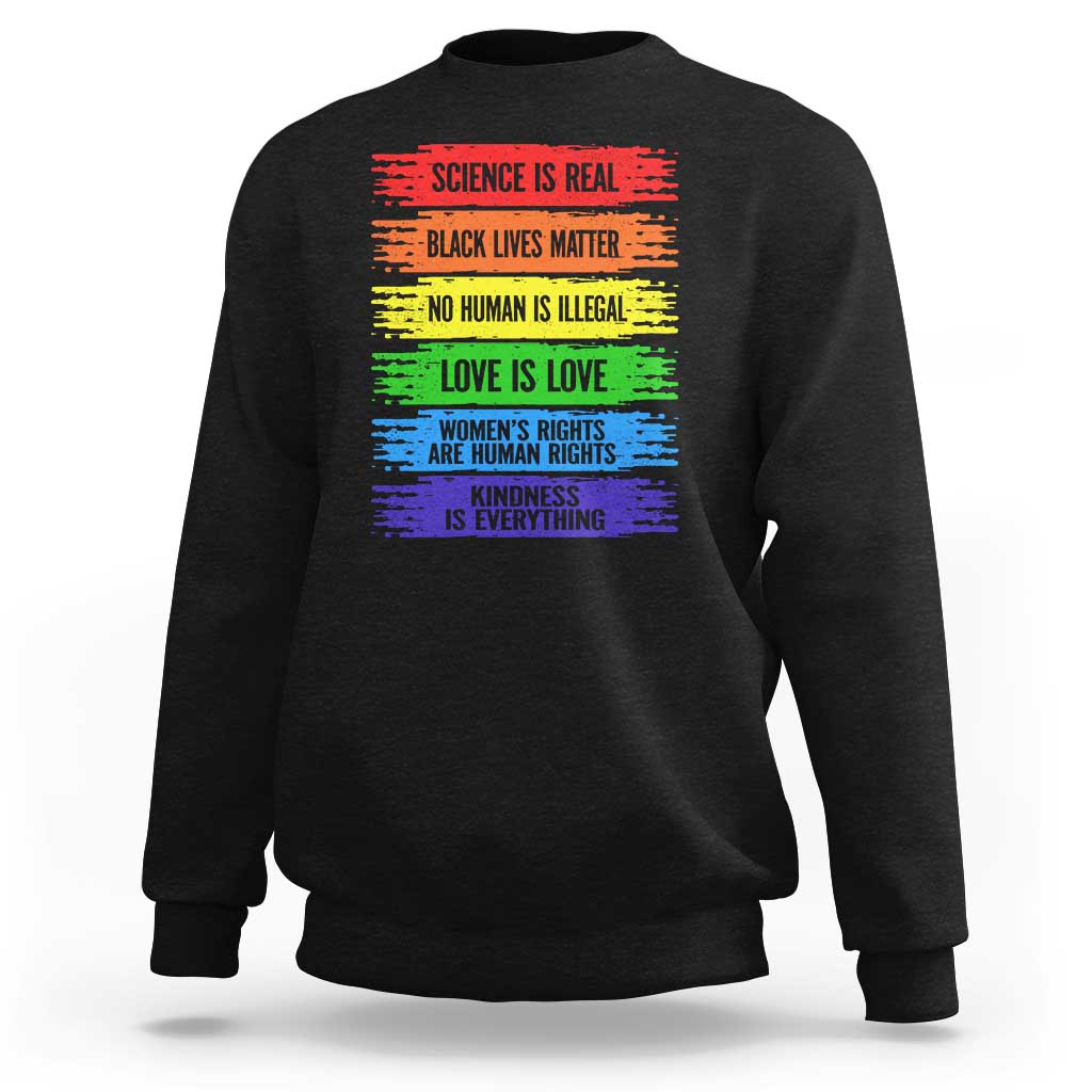 Black crewneck sweatshirt with rainbow text graphic on the front