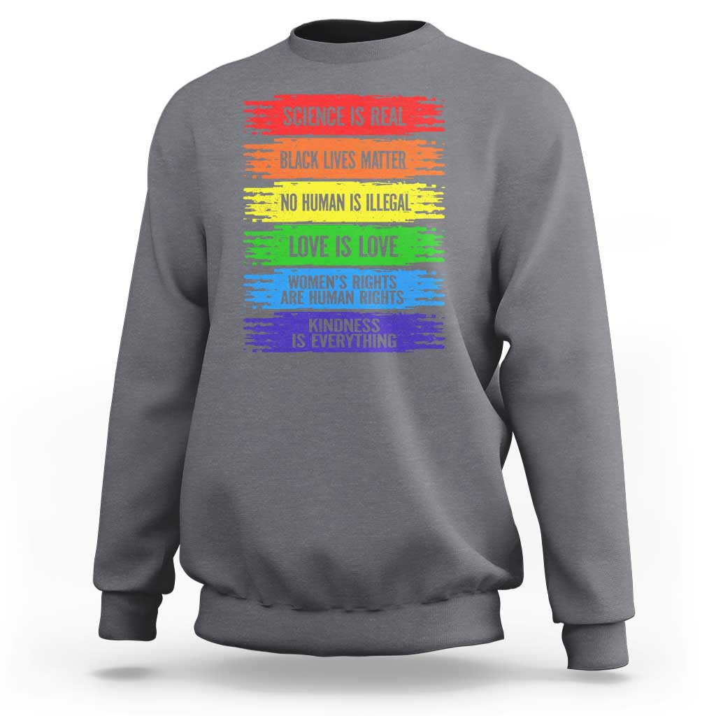 Charcoal crewneck sweatshirt with rainbow text graphic on the front