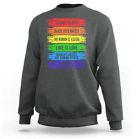 Dark heather crewneck sweatshirt with rainbow text graphic on the front