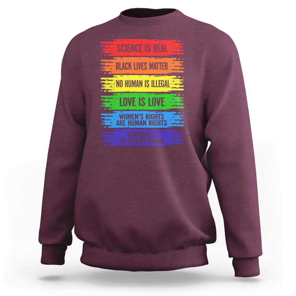 Maroon crewneck sweatshirt with rainbow text graphic on the front