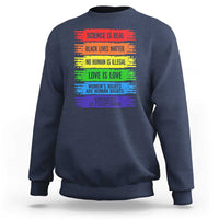 Navy crewneck sweatshirt with rainbow text graphic on the front