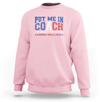 Light pink crewneck sweatshirt with blue “Put Me In Coach” election graphic on front