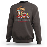 Dark brown sweatshirt with cartoon pets graphic and red slogan text on the chest