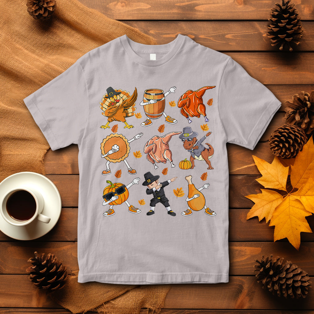 Pale gray Thanksgiving graphic T-shirt with dancing turkey, dinosaur, and pumpkin pie characters
