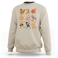 Sand crewneck sweatshirt with colorful Thanksgiving character graphic across the chest