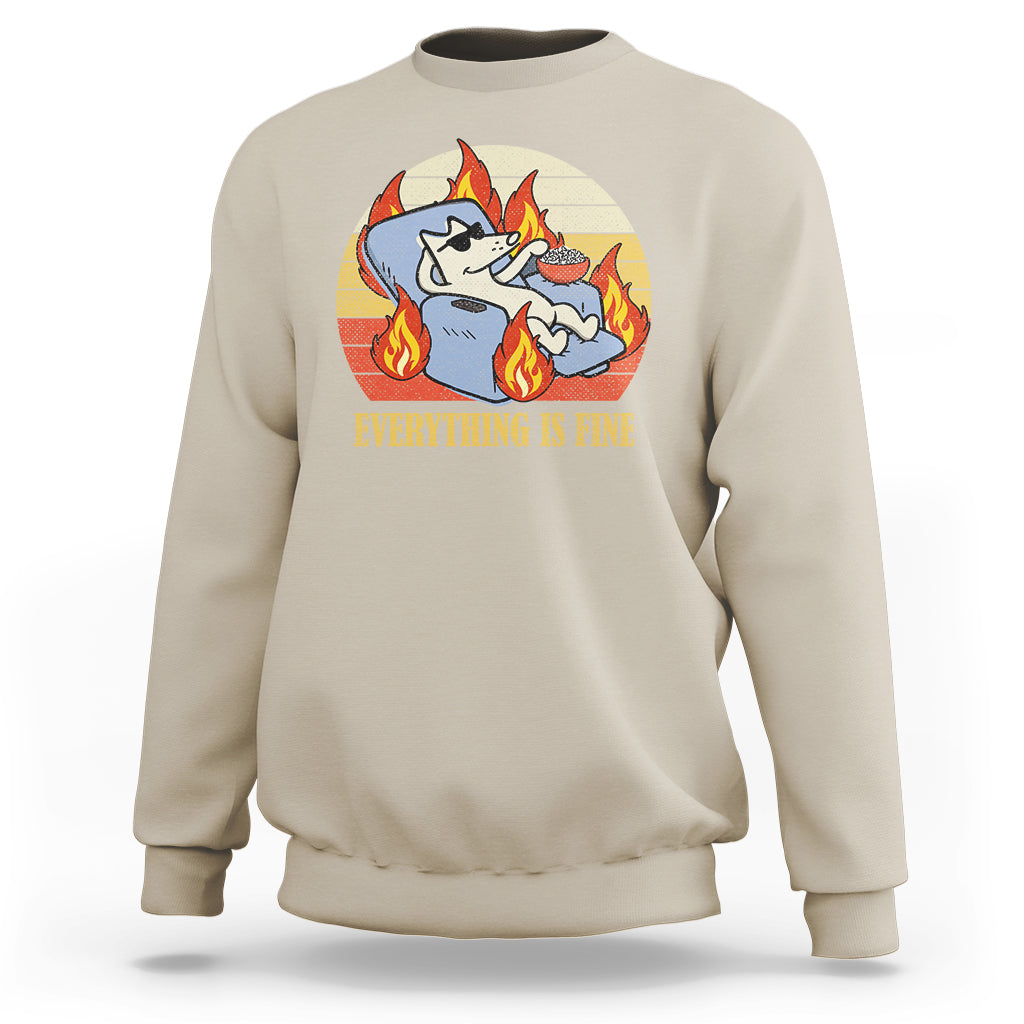 Sand beige sweatshirt with front circular dog-with-flames graphic and “EVERYTHING IS FINE” text.