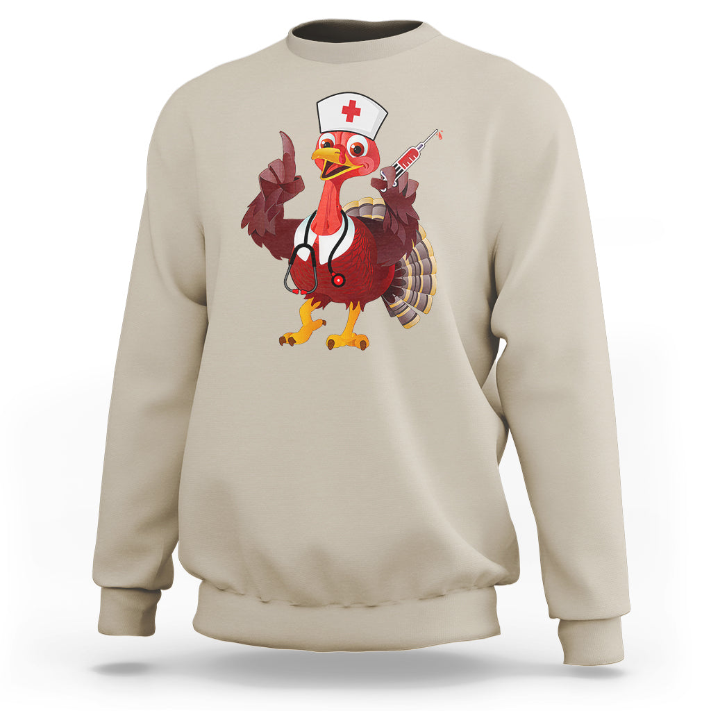 Sand sweatshirt with turkey nurse graphic holding stethoscope-style accessory, crewneck long sleeves